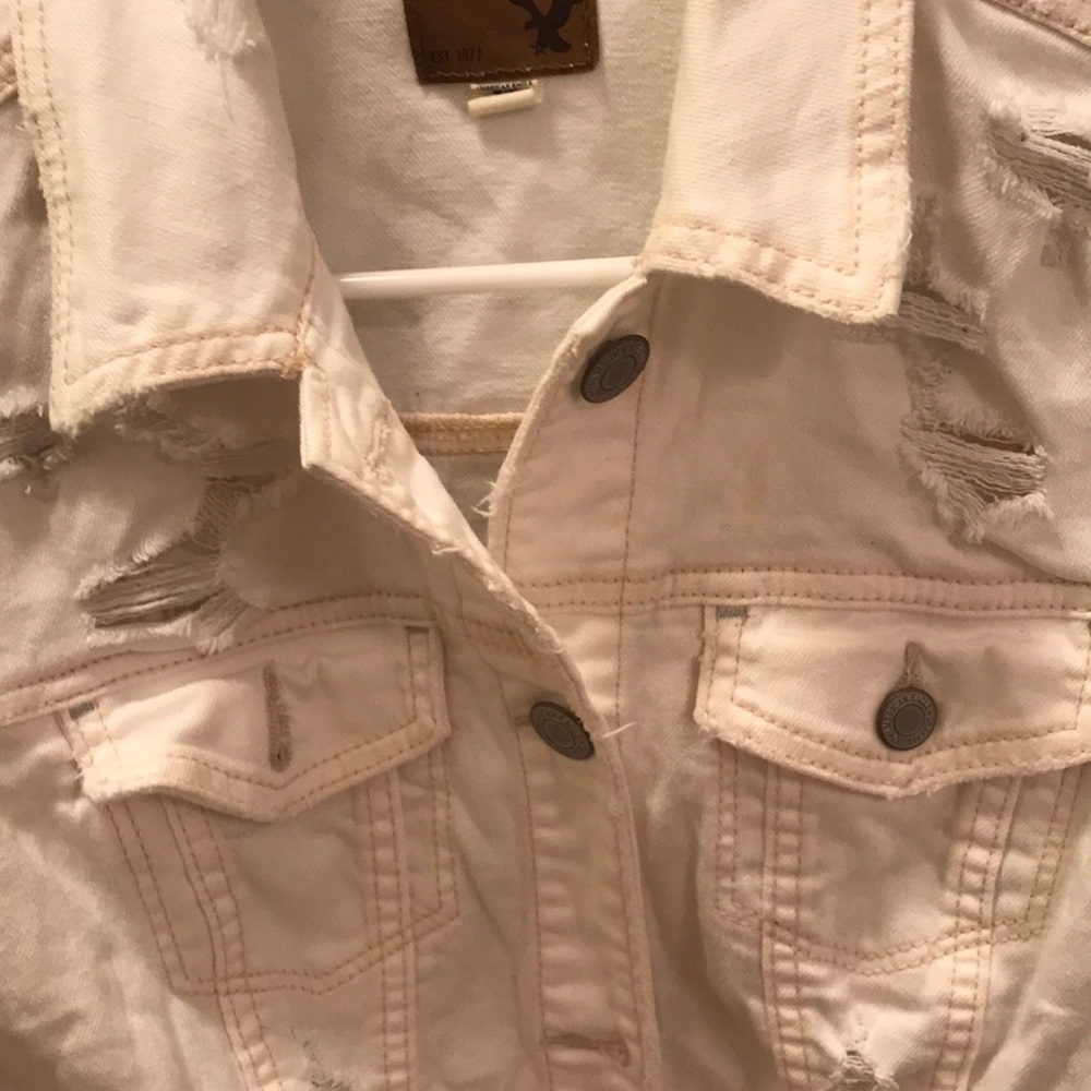 Distressed white denim jacket
